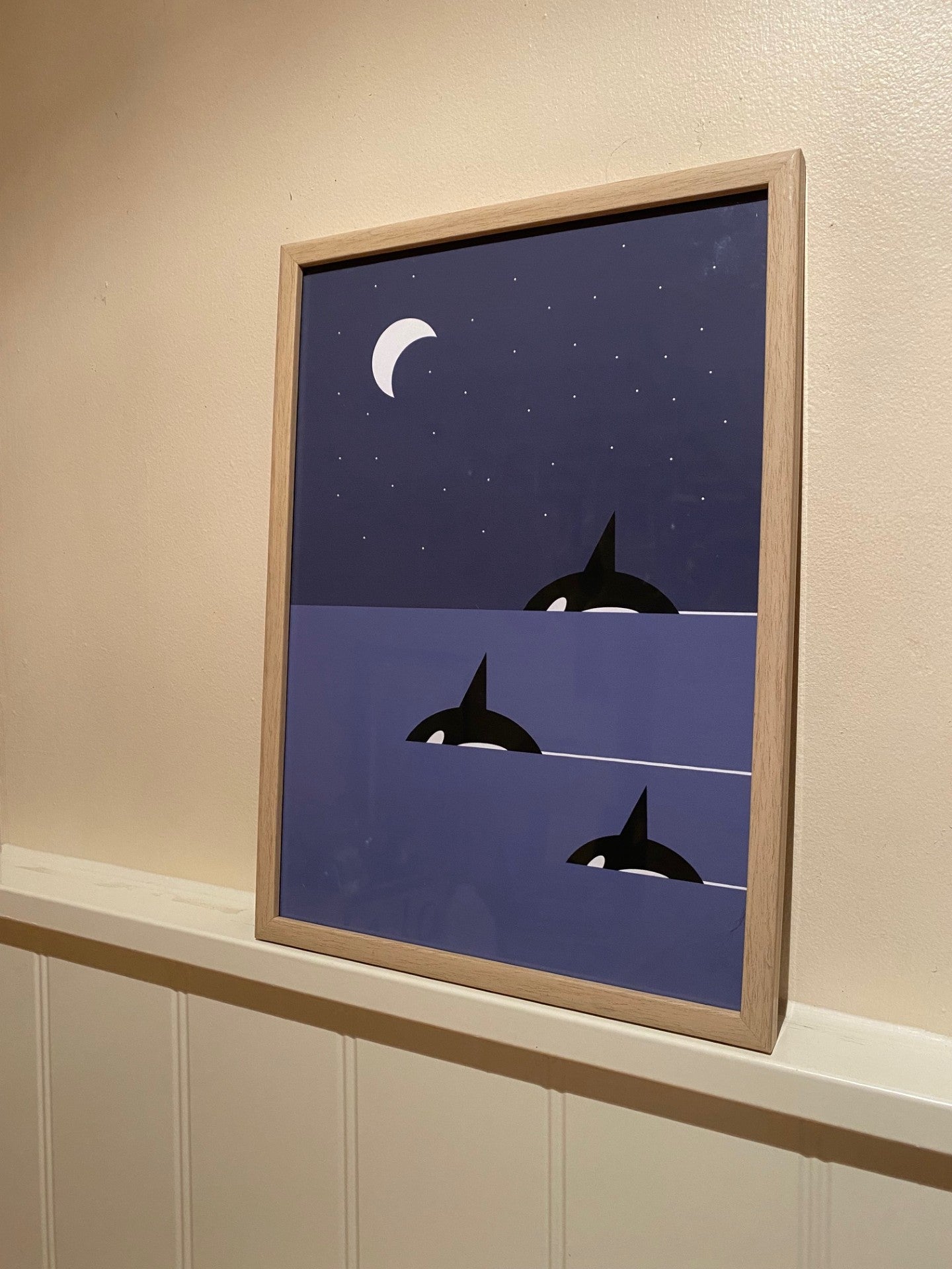 Family Orca art print showing a pod of killer whales swimming under moonlight